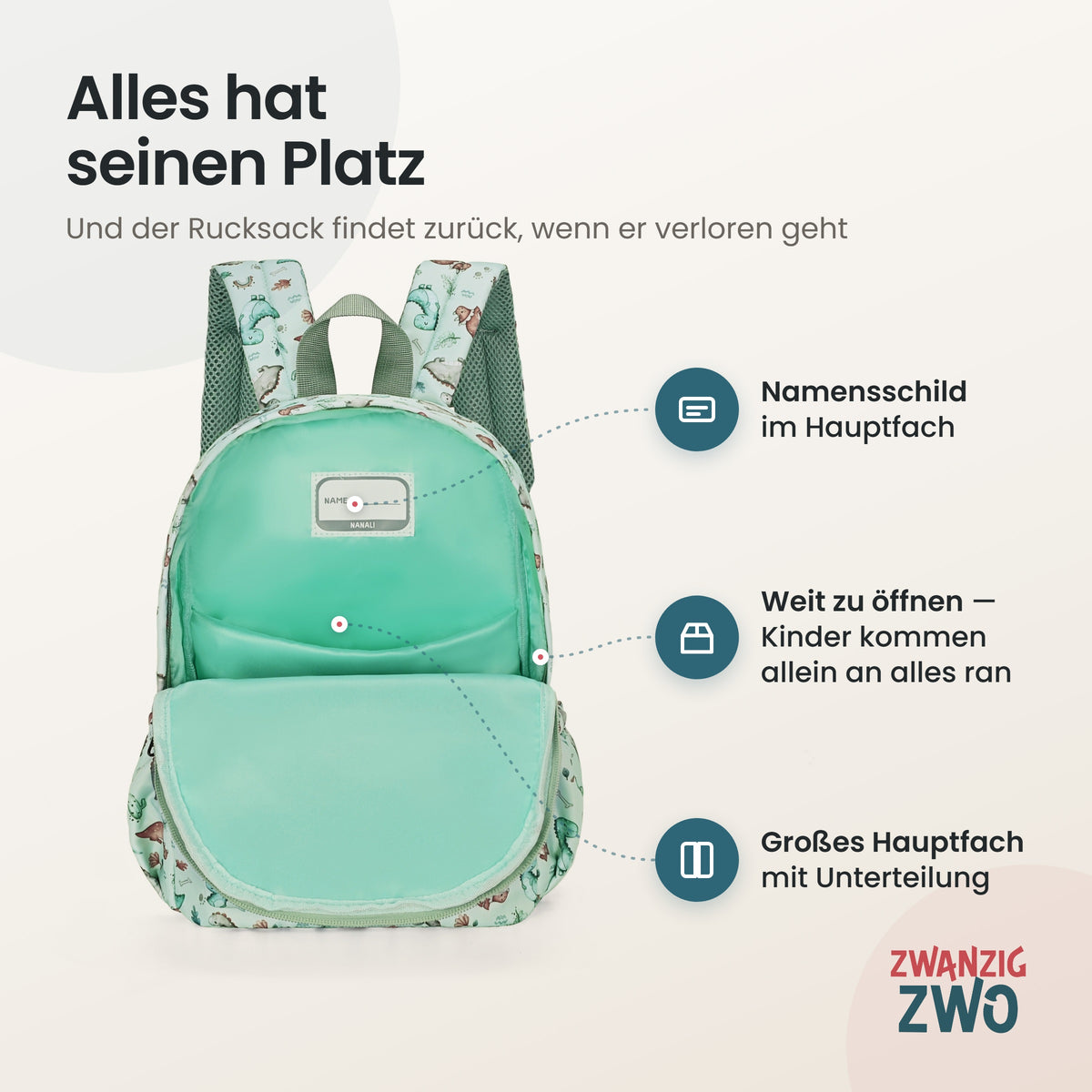 Kinderrucksack kleine Dinos – geöffnetes Hauptfach mit Namensschild und Unterteilung